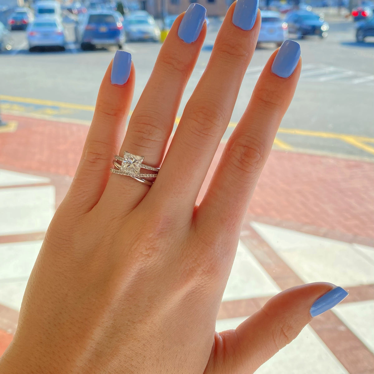 Female Model Wearing Interlocking Two-Tone Diamond Ring  -14k gold, 2.50 grams,  -51 round shared prong-set brilliant diamonds .36 carats.