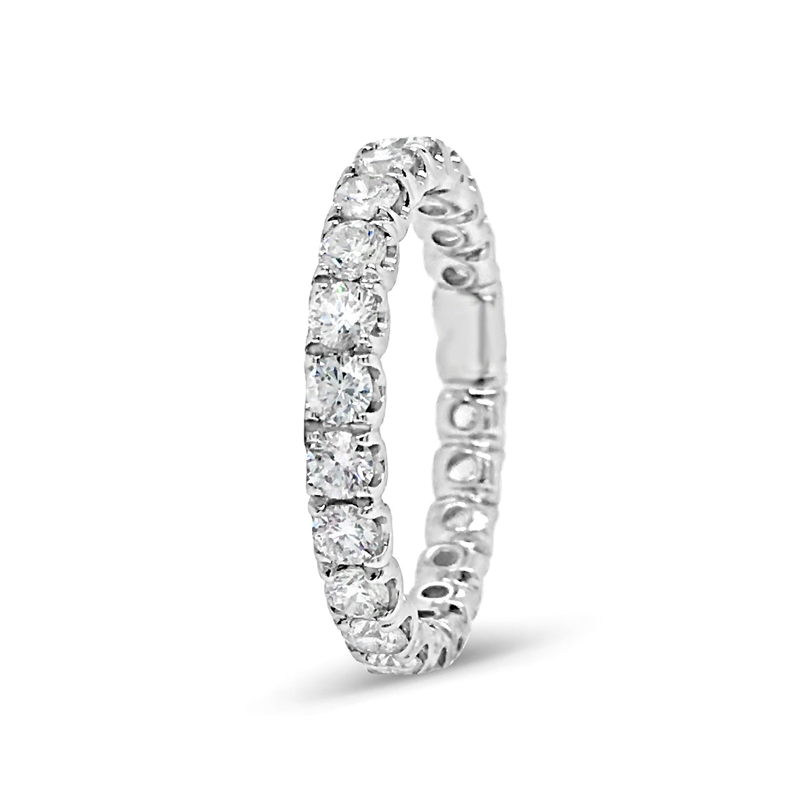 Simple Four Prong-Set Diamond Eternity Band  -18k gold weighing 2.38 grams  -24 round diamonds weighing 1.49 carats