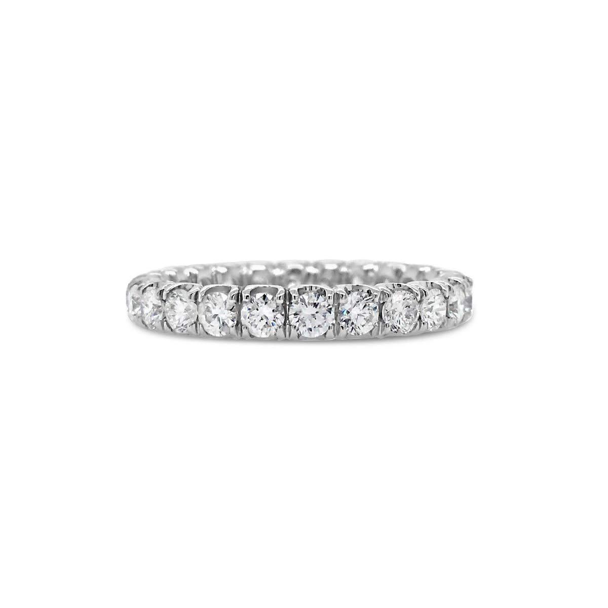 Simple Four Prong-Set Diamond Eternity Band  -18k gold weighing 2.38 grams  -24 round diamonds weighing 1.49 carats