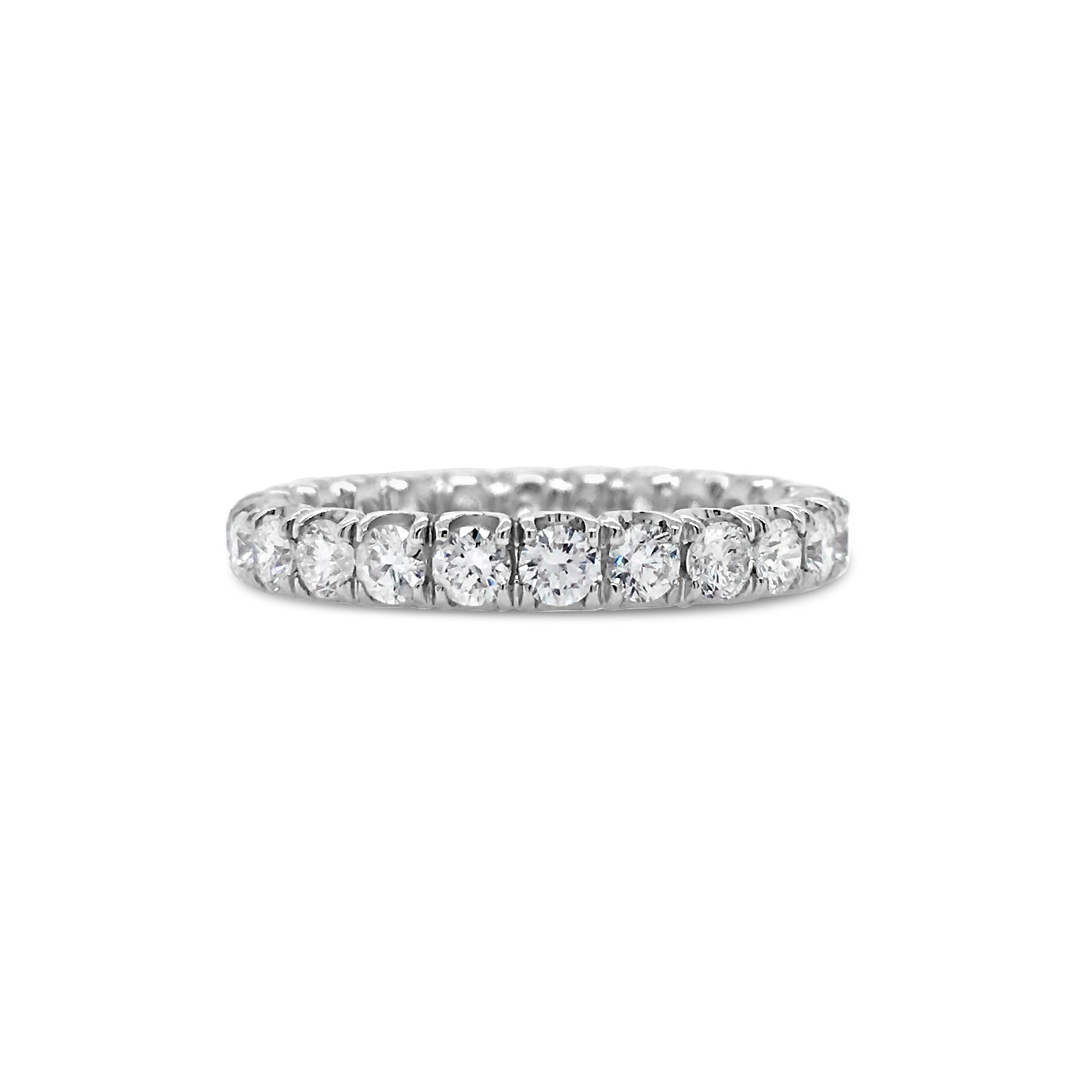 Simple Four Prong-Set Diamond Eternity Band  -18k gold weighing 2.38 grams  -24 round diamonds weighing 1.49 carats
