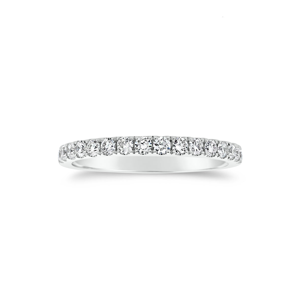 Slim Four Prong-Set Diamond Eternity Band  -18k gold weighing 1.60 grams  -34 round four prong-set diamonds weighing .71 carats