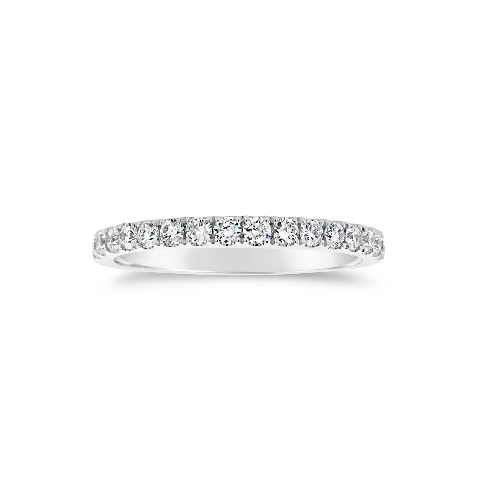 Slim Four Prong-Set Diamond Eternity Band  -18k gold weighing 1.60 grams  -34 round four prong-set diamonds weighing .71 carats