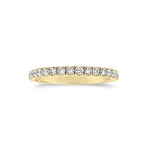 Slim Four Prong-Set Diamond Eternity Band  -18k gold weighing 1.60 grams  -34 round four prong-set diamonds weighing .71 carats