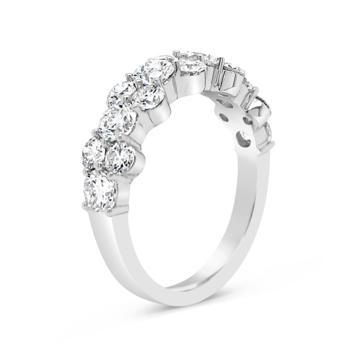 Prong-Set Diamond Staggered Wedding Band  -18k gold weighing 3.98 grams  -10 round diamonds weighing .80 carats  -6 round diamonds weighing 1.04 carats