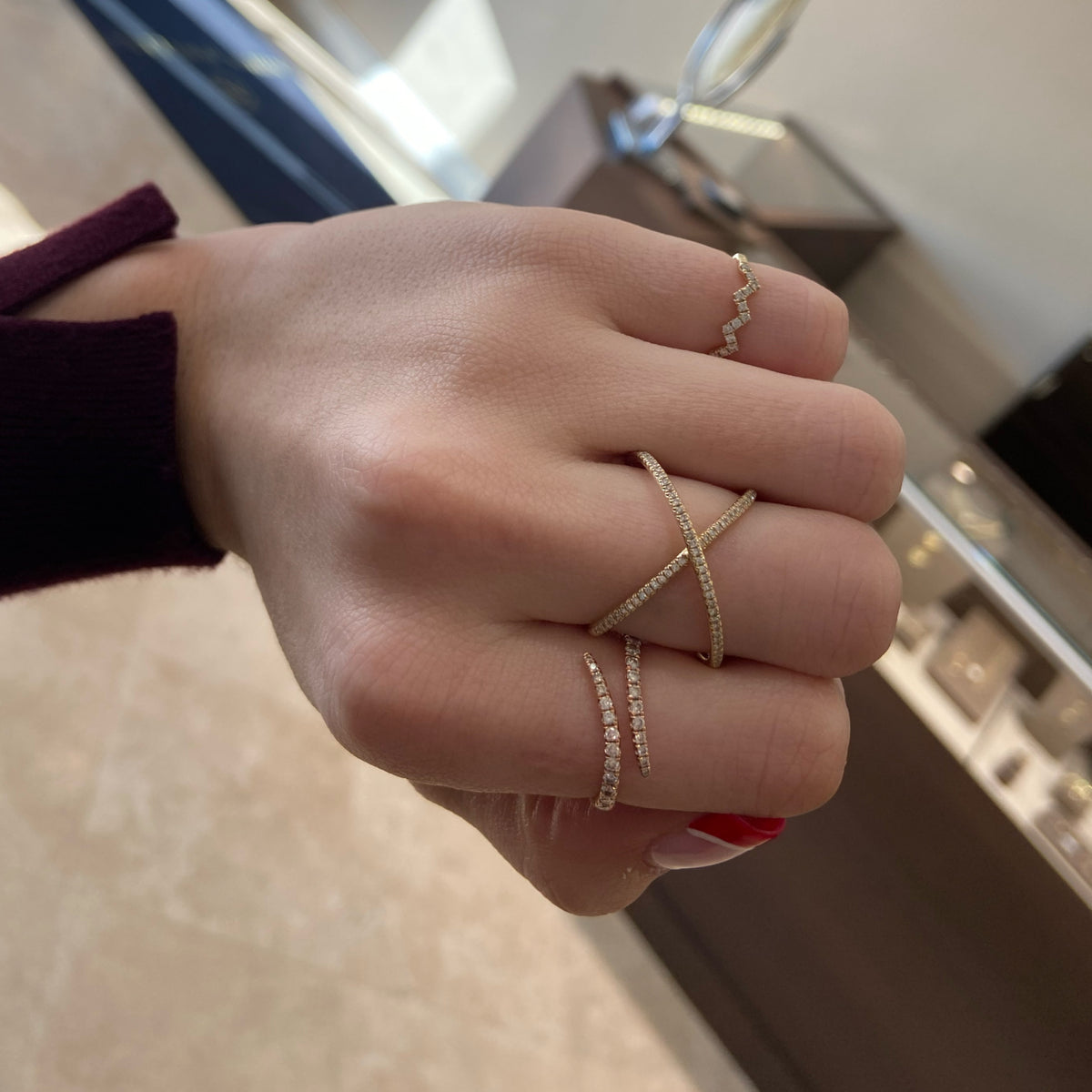 Female Model Wearing Petite Diamond Swirl Fashion Ring  -14k gold weighing 2.01 grams  -26 round diamonds weighing .36 carats