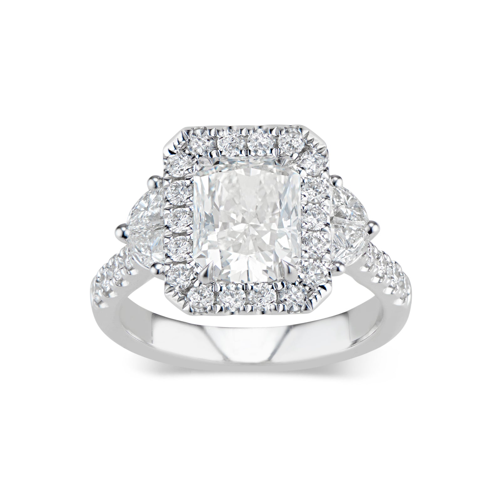 Elongated Radiant-Cut Diamond Engagement Ring  -18K weighting 5.07 GR  - 28 round diamonds totaling 0.60 carats  - 4 half moon diamonds totaling 0.51 carats