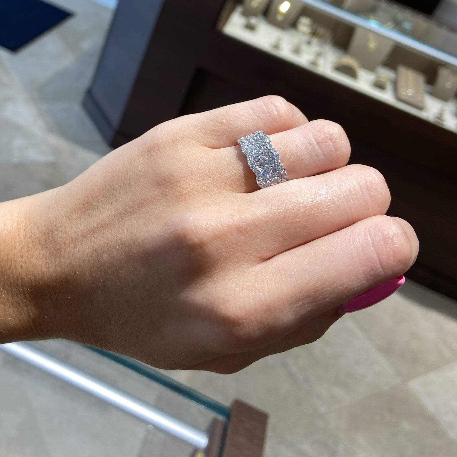 A cluster of diamonds set amid curvy waves creating a beautiful and unique look around your finger.Diamond Cluster Wave Ring  18k gold, 5.48 grams, 20 round shared prong-set brilliant diamonds 1.34 carats, 65 round shared prong-set brilliant diamonds .48 carats.