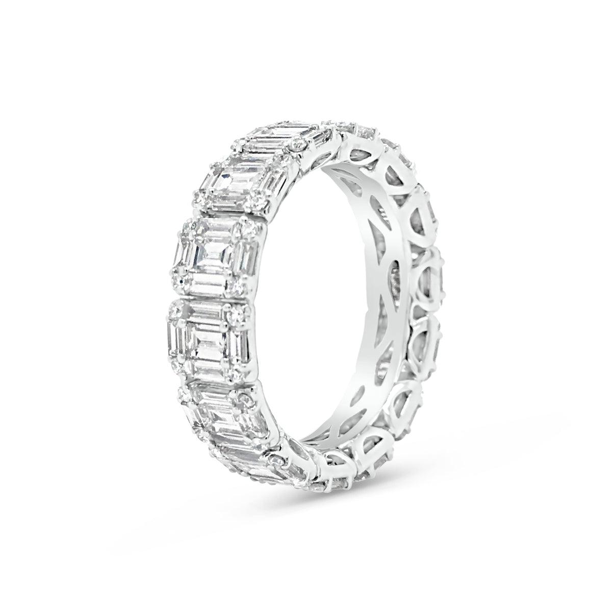 Illusion set Baguette & Round Eternity Ring  -18k gold weighing 4.16 grams  -56 round diamonds weighing .31 carats  -70 straight baguettes weighing 2.59 carats