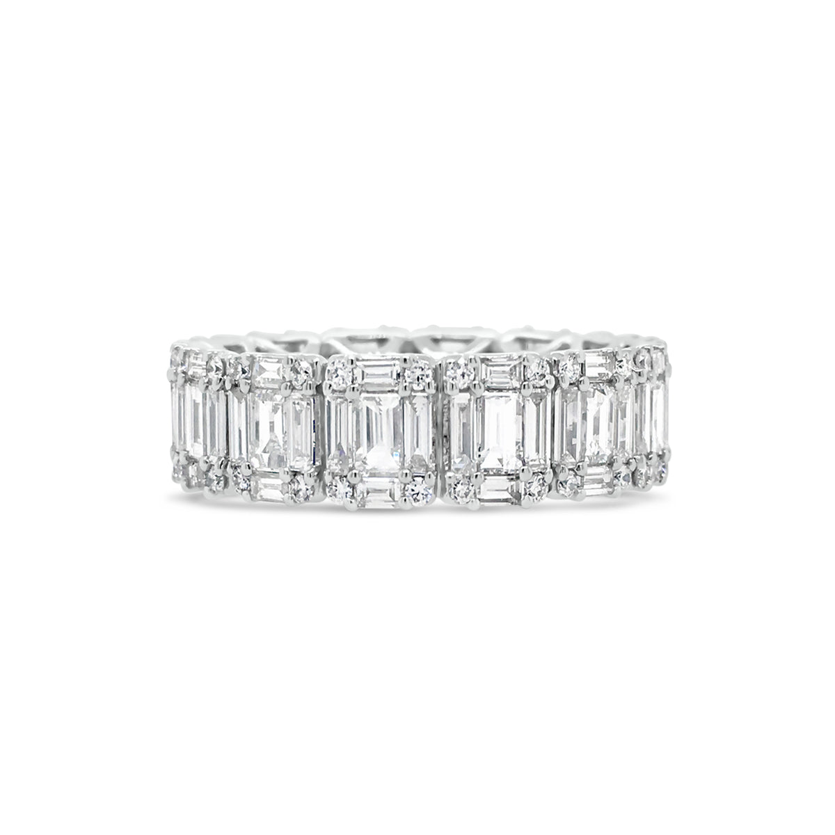 Illusion set Baguette & Round Eternity Ring  -18k gold weighing 4.16 grams  -56 round diamonds weighing .31 carats  -70 straight baguettes weighing 2.59 carats