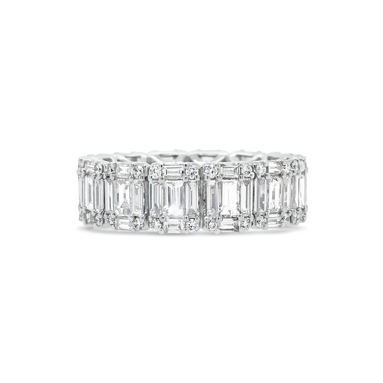 Illusion set Baguette & Round Eternity Ring  -18k gold weighing 4.16 grams  -56 round diamonds weighing .31 carats  -70 straight baguettes weighing 2.59 carats