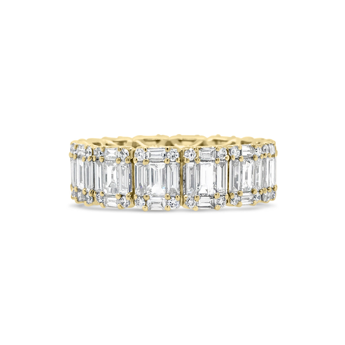 Illusion set Baguette & Round Eternity Ring  -18k gold weighing 4.16 grams  -56 round diamonds weighing .31 carats  -70 straight baguettes weighing 2.59 carats