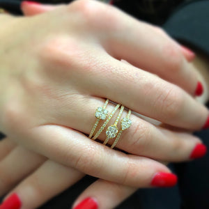 Female Model Wearing Mixed Shape Diamond Fashion Ring  -18k gold 6.21 grams  -106 round diamonds weighing 1.00 carats.