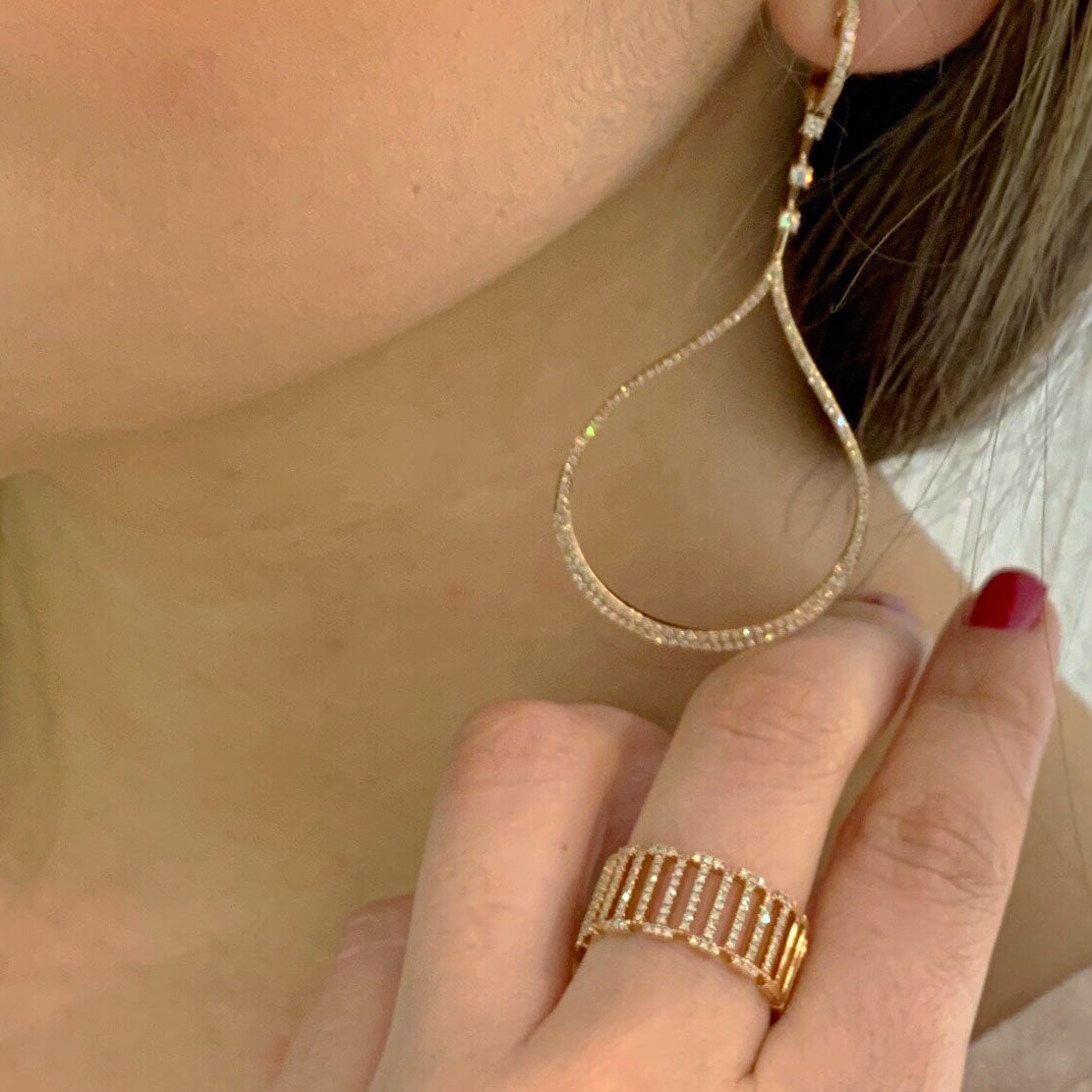 Diamond Open Teardrop Dangle Earrings  -14K gold weighing 6.37 grams  -306 round diamonds totaling 0.78 carats  -6 prong-set diamonds totaling 0.16 carats