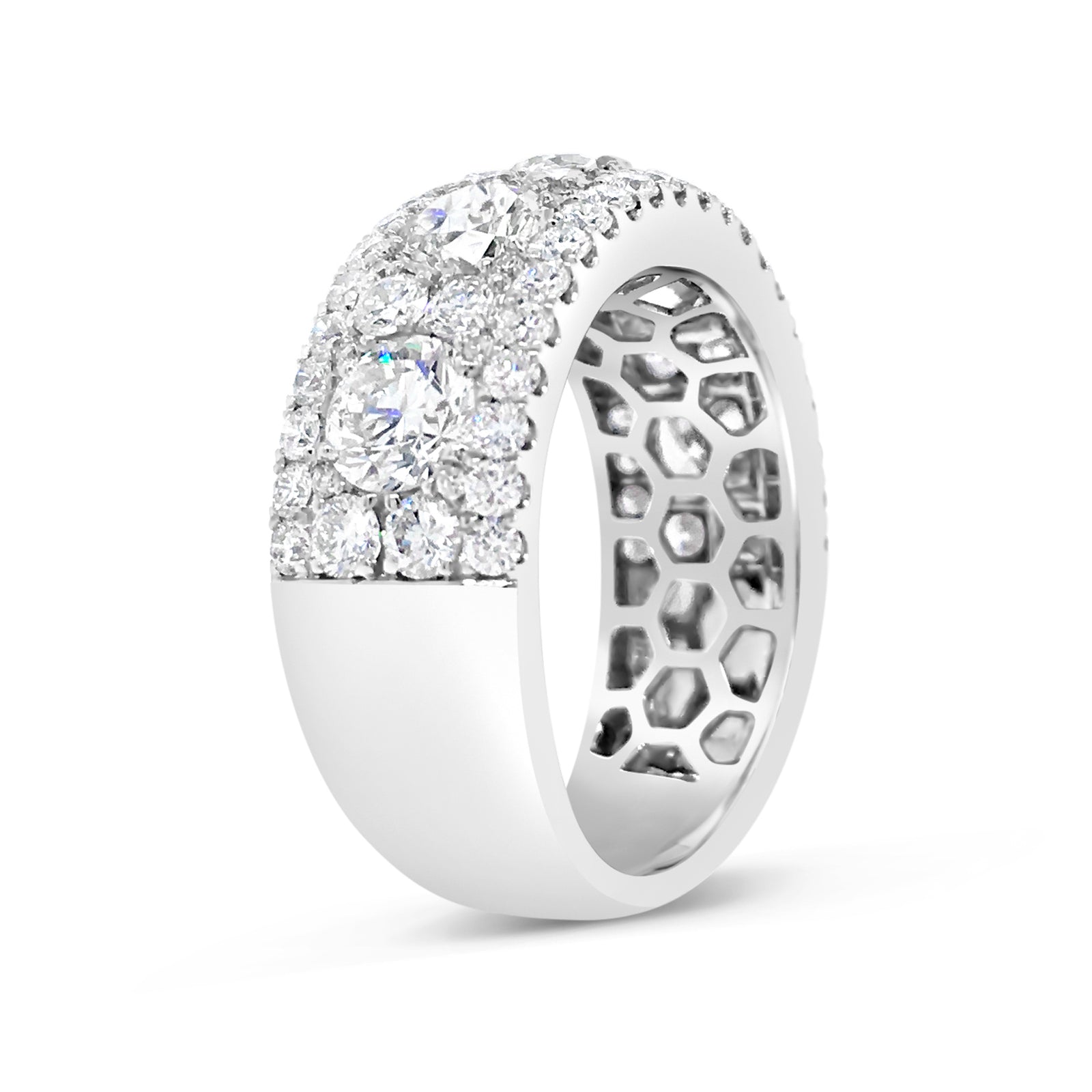 Diamond Cluster Band Ring  -18k gold weighing 7.7 grams  -76 round four prong-set diamonds weighing 1.46 carats   -5 round four prong-set diamonds weighing 2.16 carats 