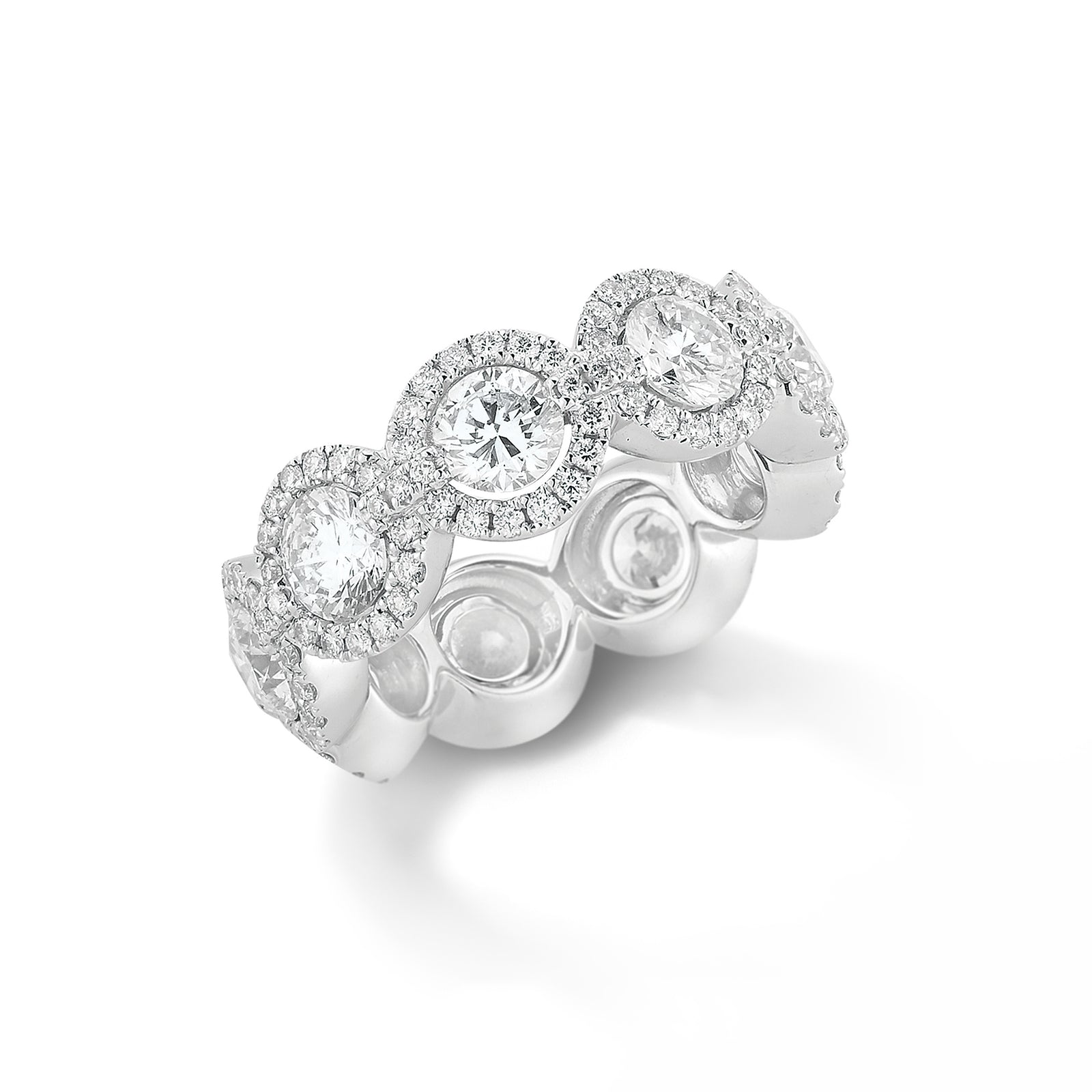 Halo Diamond Eternity Band  -18k gold, 7.95 grams, 153 round shared prong-set brilliant diamonds 1.09 carats.  - 9 round brilliant diamonds 4.12 carats.