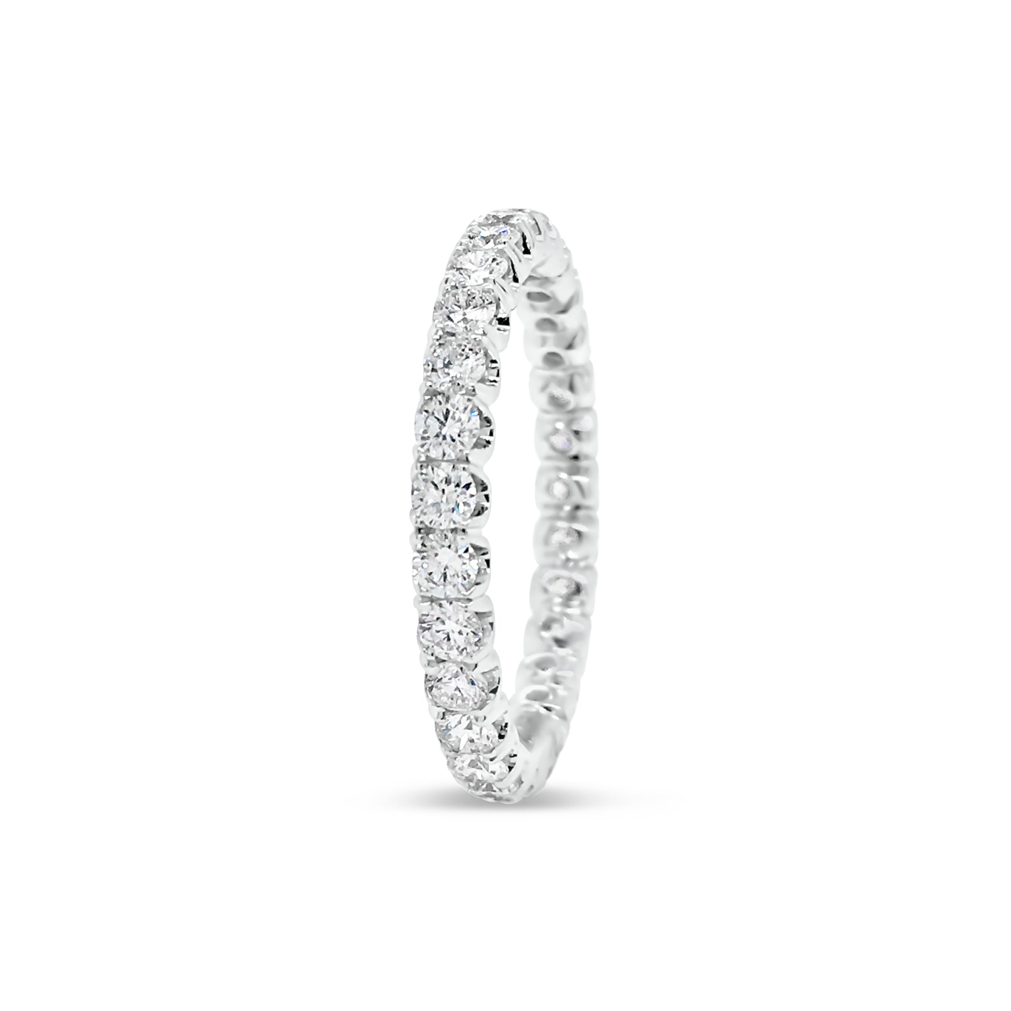Four Prong-Set Diamond Eternity Wedding Band  -18k gold weighing 2.04 grams  -29 round diamonds weighing 1.11 carats