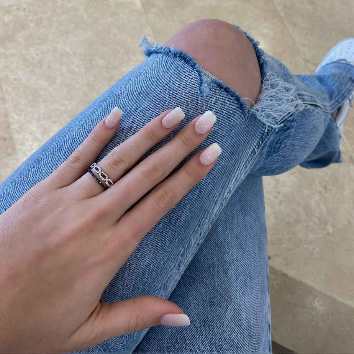 Female Model Wearing Simple Sapphire Eternity Band -14k gold weighing 1.06 grams  -31 blue sapphires weighing .43 carats