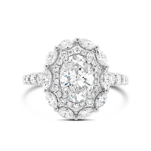 Antique Diamond Engagement Ring  -18k gold weighing 3.51 grams  -10 marquise diamonds weighing .49 carats  -32 round diamonds weighing .48 carats with  -1 oval brilliant cut diamond weighing 1.22 carats with J color I1