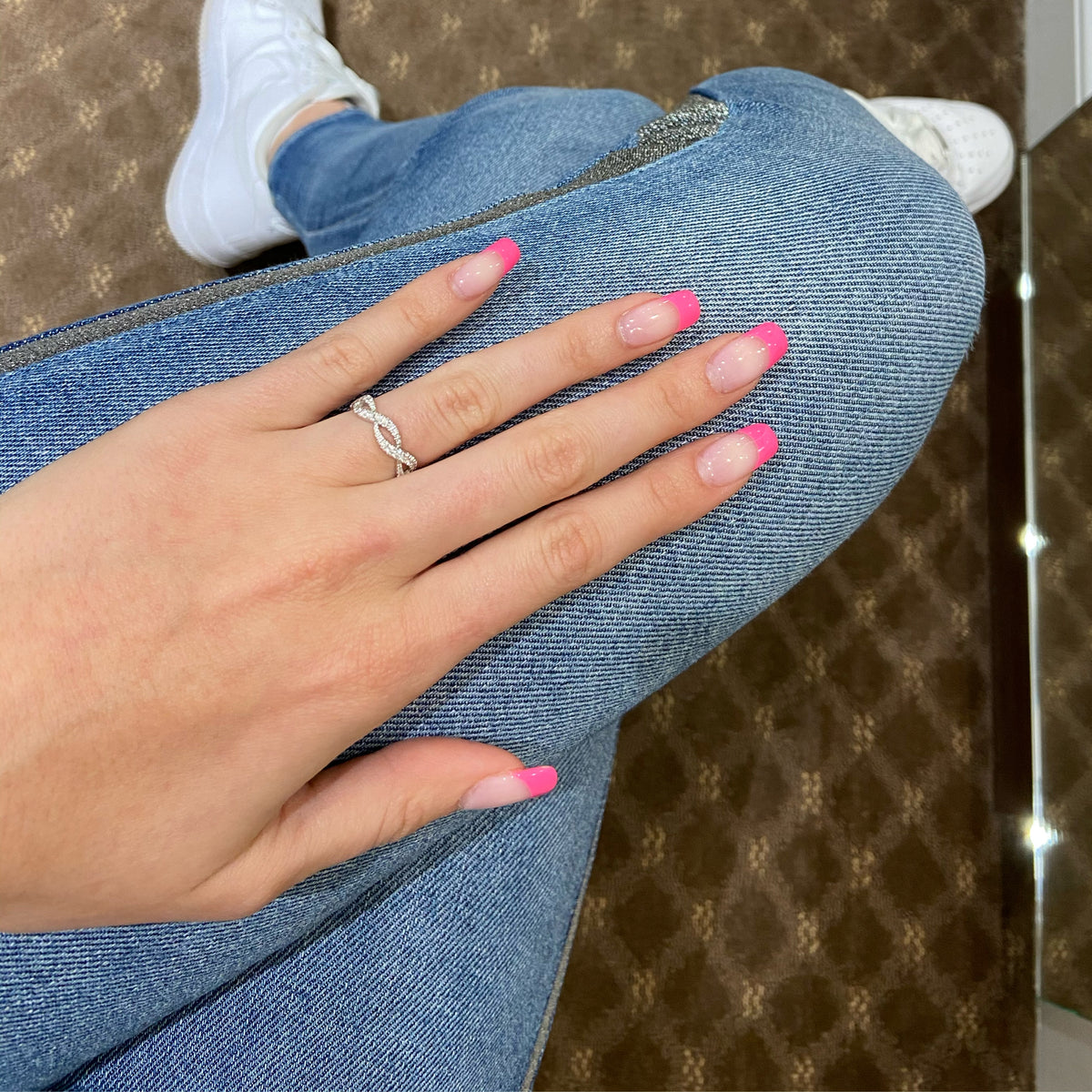 Female model wearing Twisted Diamond Fashion Ring  18k gold, 2.21 grams, 66 round shared prong-set brilliant diamonds weighing .74 carats.