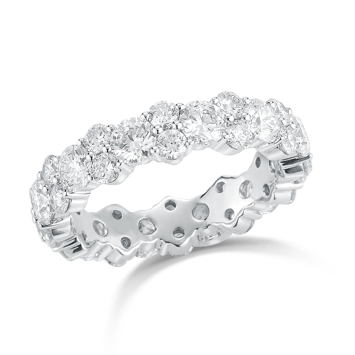 Staggered Diamond Eternity Band  -18k gold weighing 4.14 grams  -12 round diamonds weighing 2.40 carats  -24 round diamonds weighing 1.38 carats