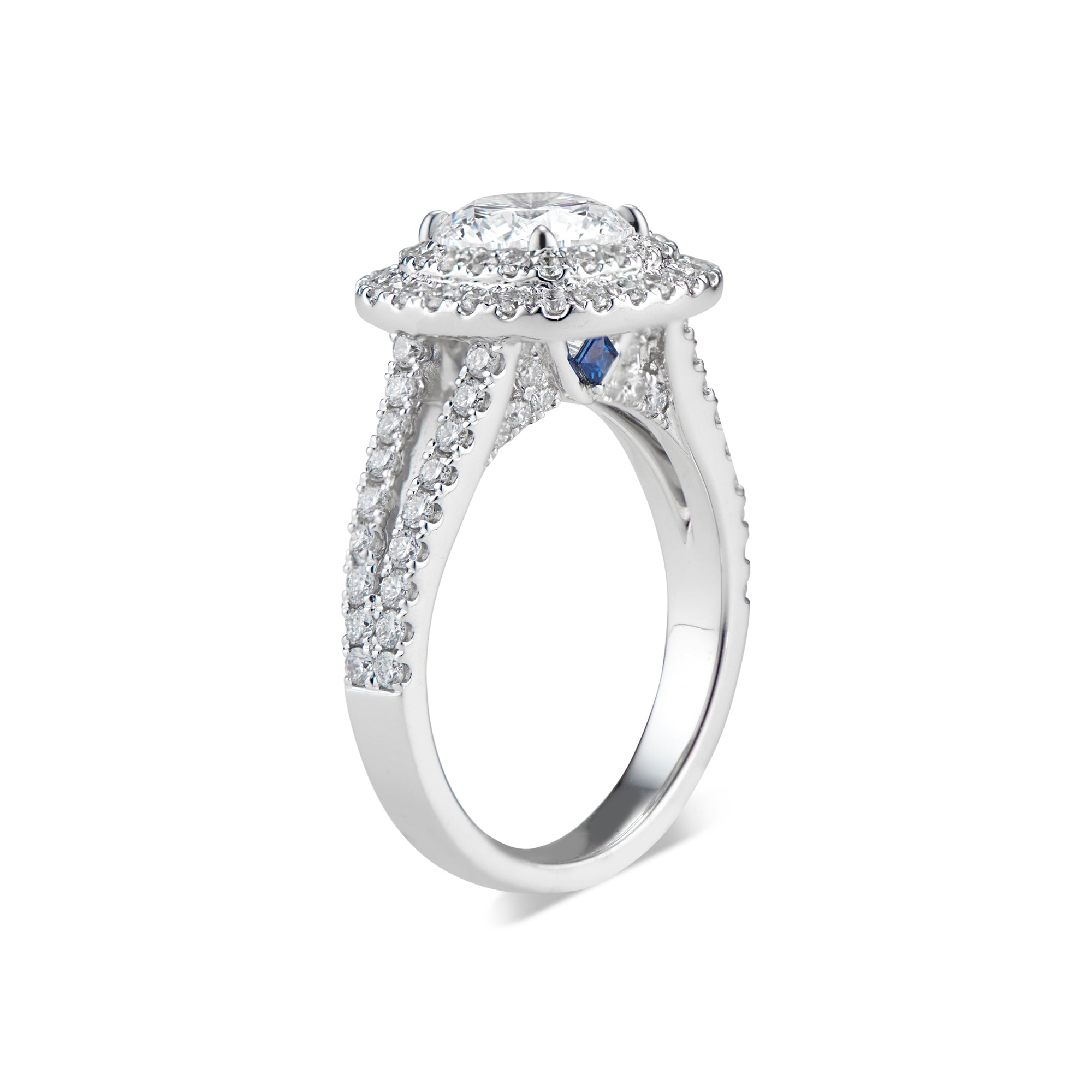 Cushion Double Halo Diamond Engagement Ring with Split Shank & Sapphire Accent Stones  -18K weighing 6.20GR  - 100 round diamonds totaling 1.01 carats  - 2 princess-cut sapphires totaling 0.08 carats