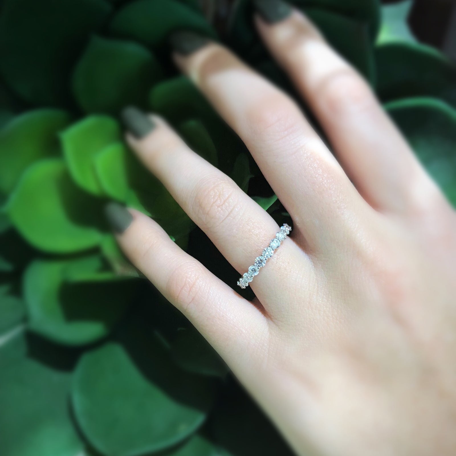 Shared Prong-Set Diamond Eternity Band  -18k gold weighing 1.94 grams  -21 round diamonds weighing 2.05 grams