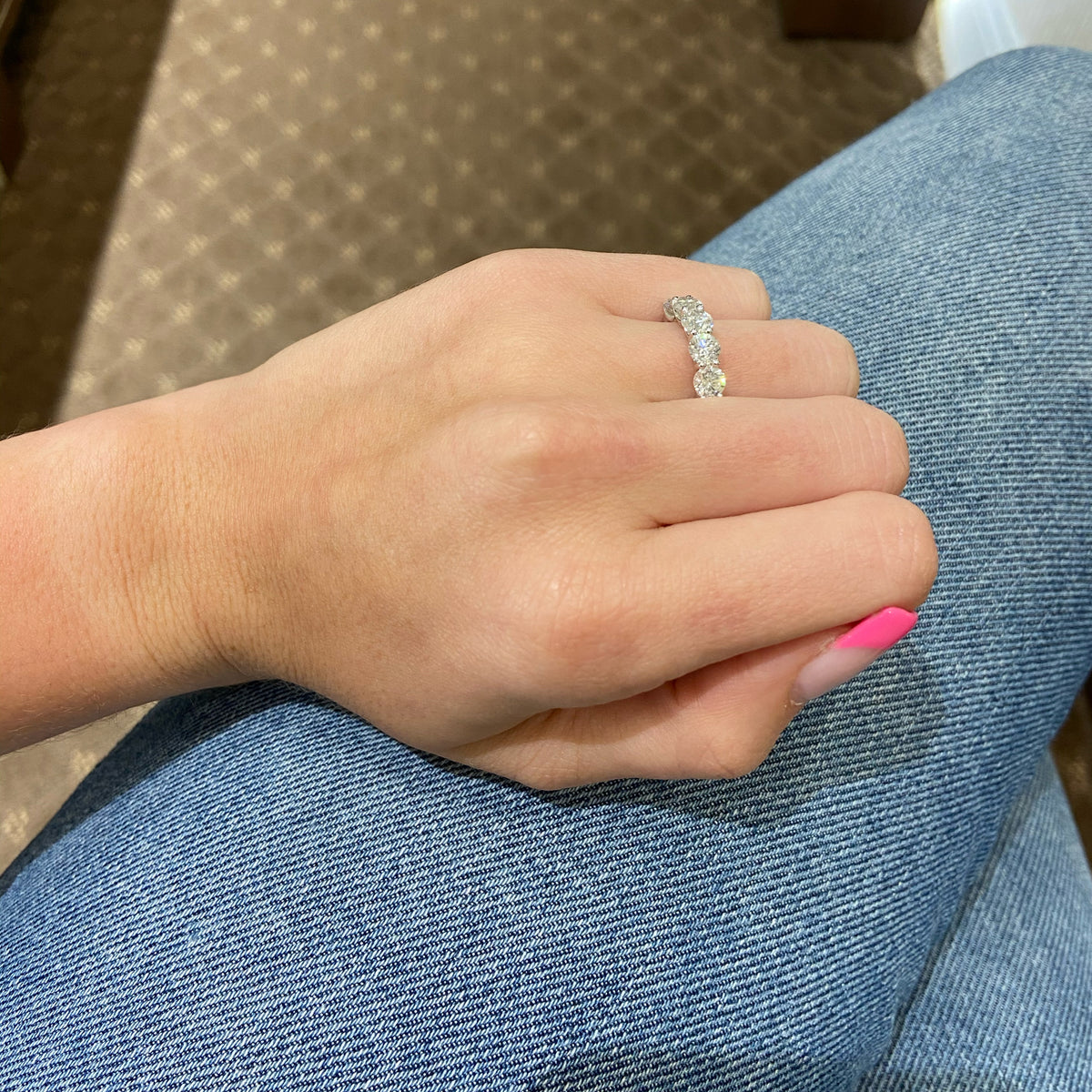 Female Model Wearing 5 Stone Diamond Anniversary Ring  -18k gold weighing 3.22 grams  -5 round diamonds weighing 2.37 carats F Color SI1-SI2 in Clarity