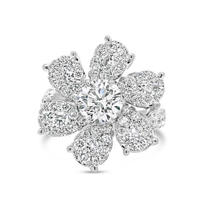 Diamond Flower Ring  -18K gold weighing 6.78 grams  -1.03 ct round brilliant-cut diamond (GIA-graded F color, I1 clarity)  -6 round diamonds totaling 0.30 carats  -60 round pave-set diamonds totaling 1.08 carats