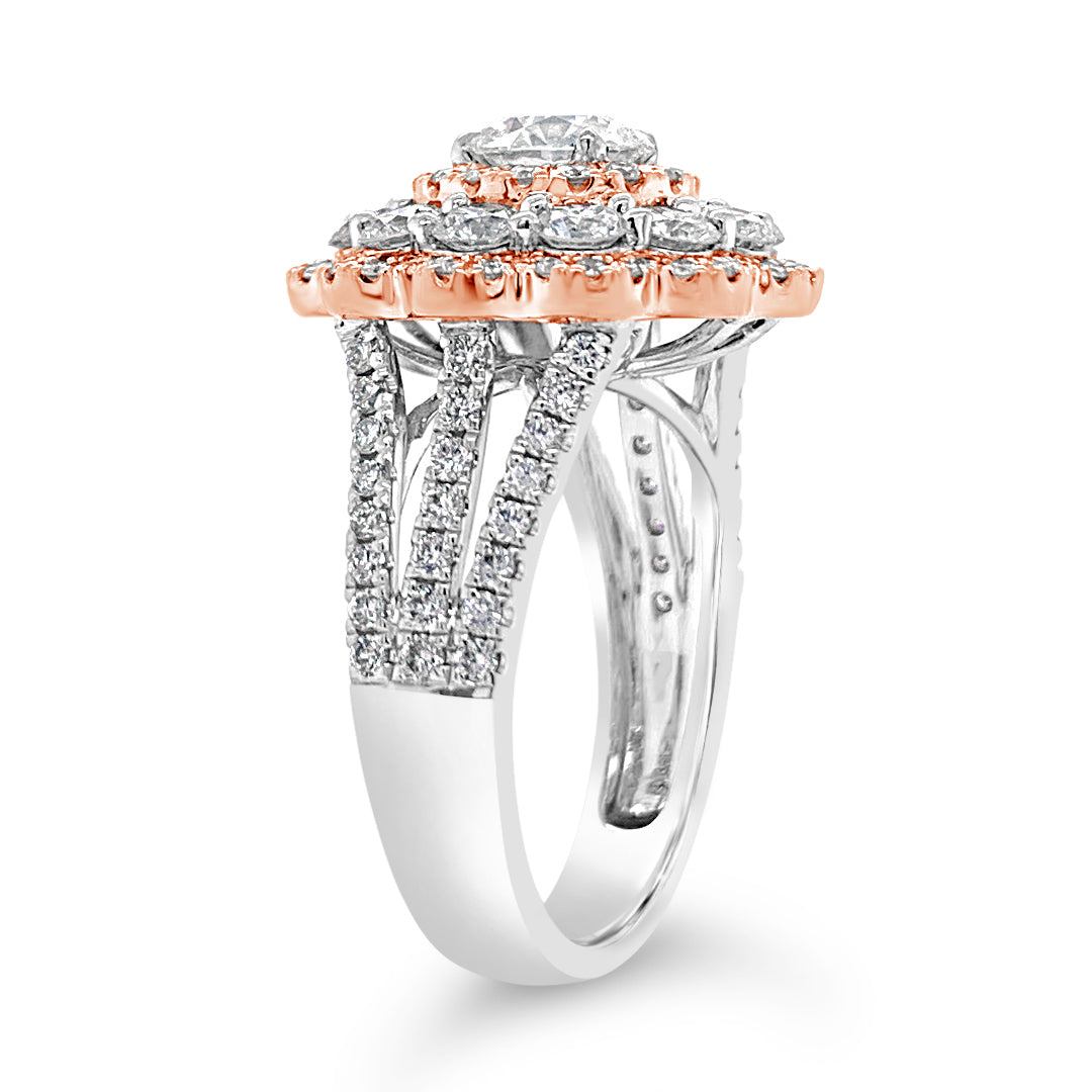 Diamond Carnation Ring  -18K gold weighing 7.21 grams  -0.88 ct round brilliant-cut diamond (GIA-graded I color, I1 clarity)  -12 round diamonds totaling 1.07 carats  -110 round diamonds totaling 0.73 carats