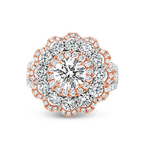 Diamond Carnation Ring  -18K gold weighing 7.21 grams  -0.88 ct round brilliant-cut diamond (GIA-graded I color, I1 clarity)  -12 round diamonds totaling 1.07 carats  -110 round diamonds totaling 0.73 carats