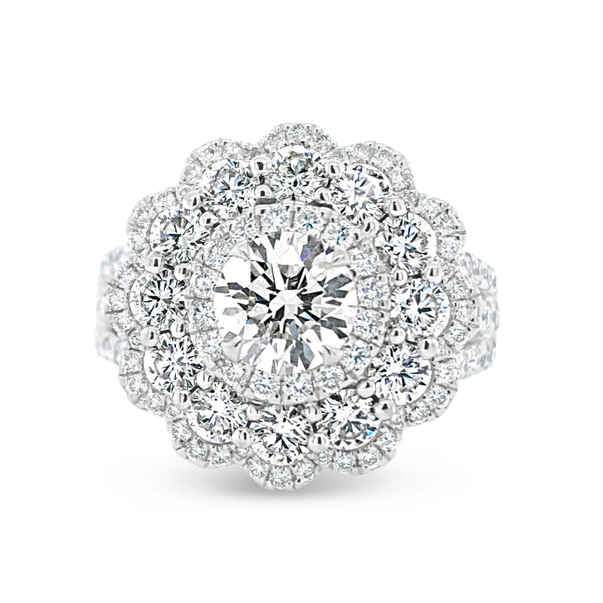 Diamond Carnation Ring  -18K gold weighing 7.21 grams  -0.88 ct round brilliant-cut diamond (GIA-graded I color, I1 clarity)  -12 round diamonds totaling 1.07 carats  -110 round diamonds totaling 0.73 carats
