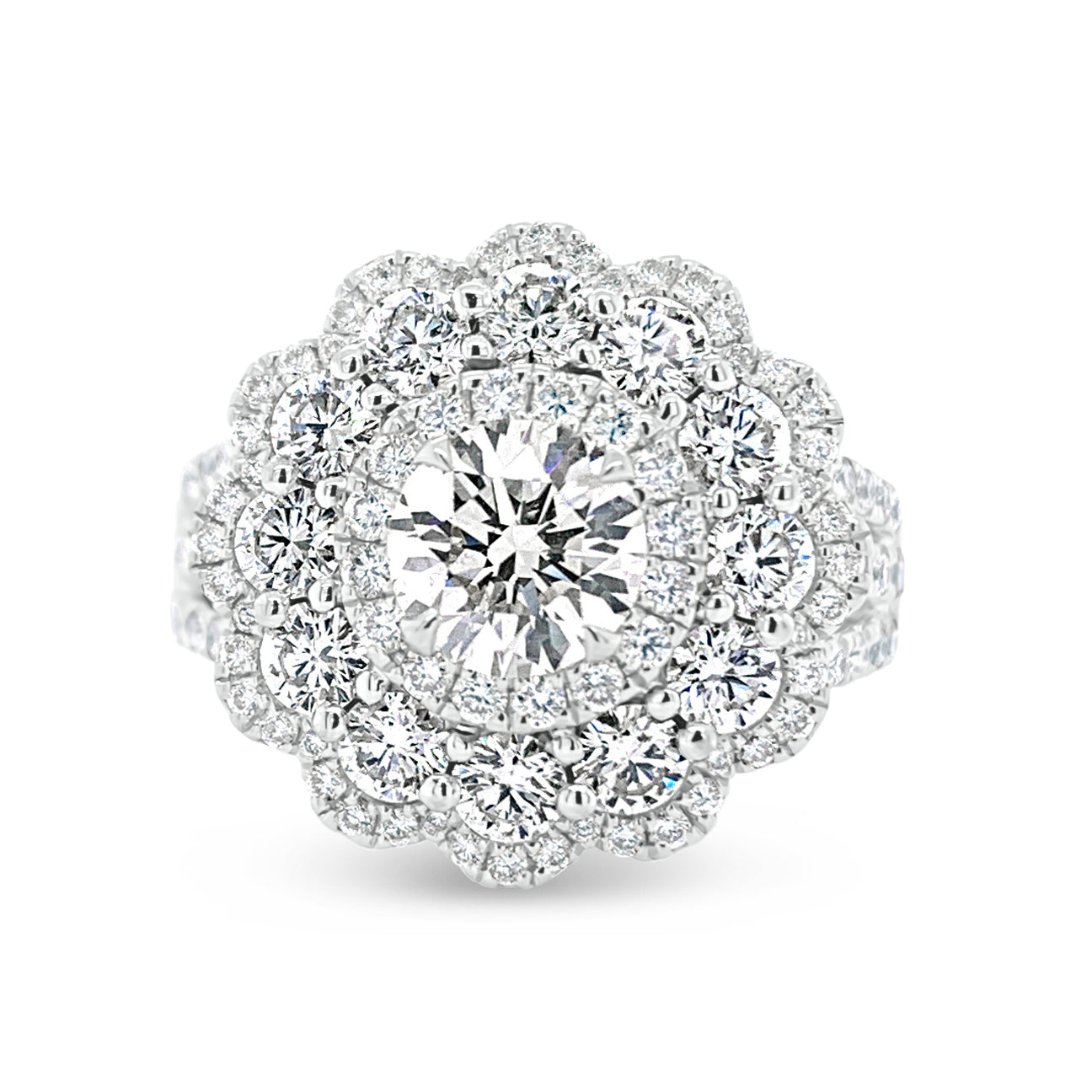 Diamond Carnation Ring  -18K gold weighing 7.21 grams  -0.88 ct round brilliant-cut diamond (GIA-graded I color, I1 clarity)  -12 round diamonds totaling 1.07 carats  -110 round diamonds totaling 0.73 carats