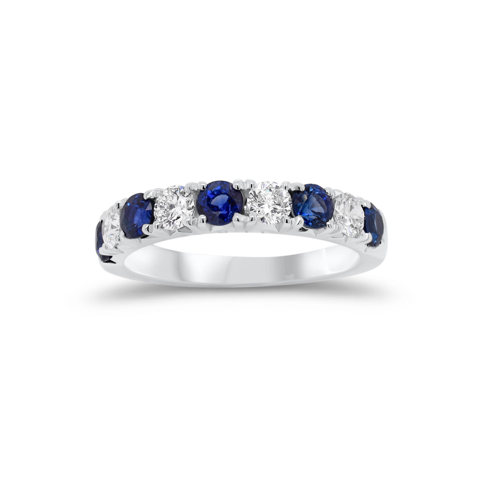 Sapphire & Diamond Wedding Band  -18K gold weighing 3.89 grams  - 5 sapphires totaling 1.09 carats  - 4 round diamonds totaling 0.49 carats