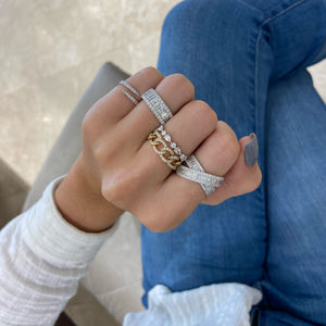Female model wearing Baguette and Round Diamond Thick Wedding Band - 18K gold weighing 5.10 grams  - 46 round diamonds weighing 0.77 carats  - 12 slim baguettes weighing 0.66 carats