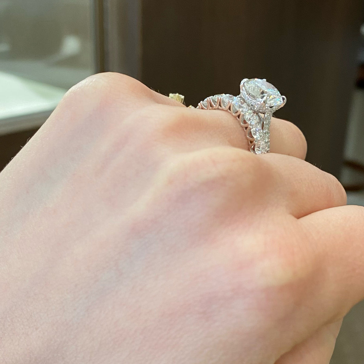 Female Model Wearing 9-Diamond Wedding Band  - 18K gold weighing 2.88 grams  - 9 round diamonds totaling 1.33 carats