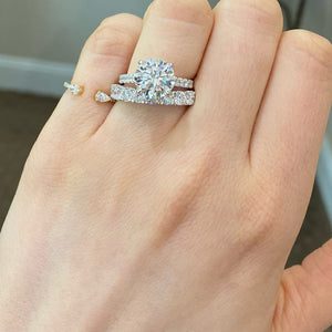 Female Model Wearing 9-Diamond Wedding Band  - 18K gold weighing 2.88 grams  - 9 round diamonds totaling 1.33 carats