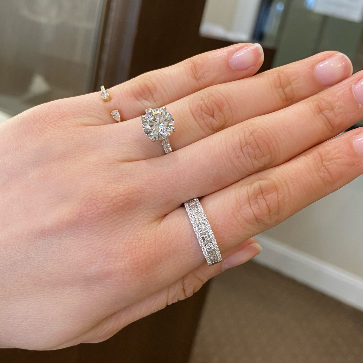 Multi-Shape Diamond Wedding Band  - 18K gold weighing 4.93 grams  - 4 slim baguettes totaling 0.43 carats  - 5 round diamonds totaling 0.35 carats  - 48 round diamonds totaling 0.22 carats