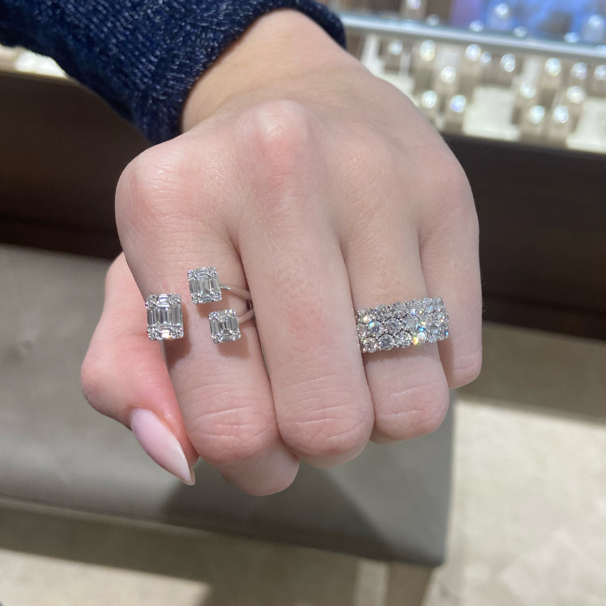 Female model wearing Diamond Triple Row Diamond Wedding Band - 18K gold weighing 7.74 grams  - 31 round diamonds weighing 3.40 carats