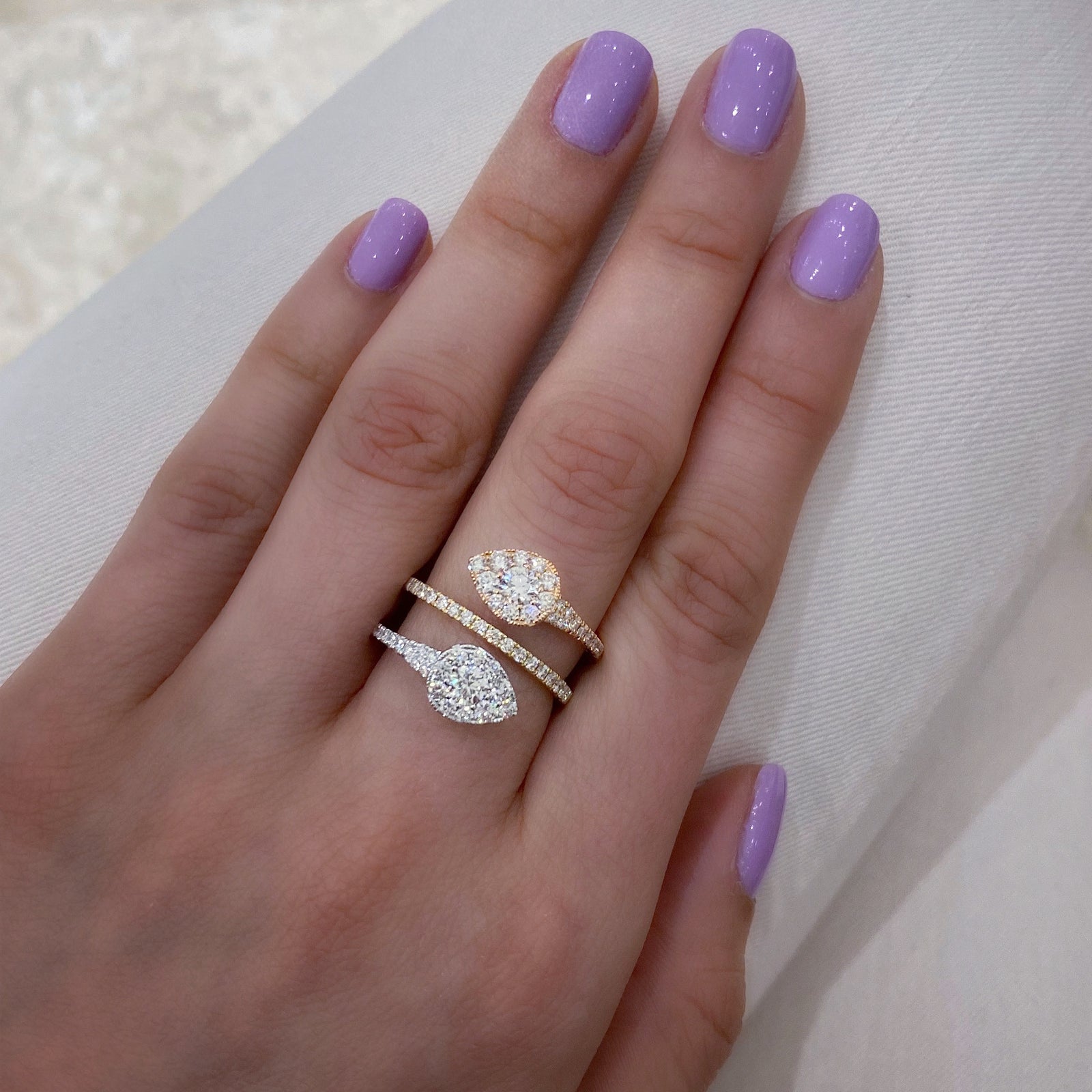 Diamond Double Teardrop Wrap Ring  -18K gold weighing 5.18 grams  -2 round brilliant-cut diamonds totaling 0.50 carats  -57 round diamonds totaling 0.90 carats