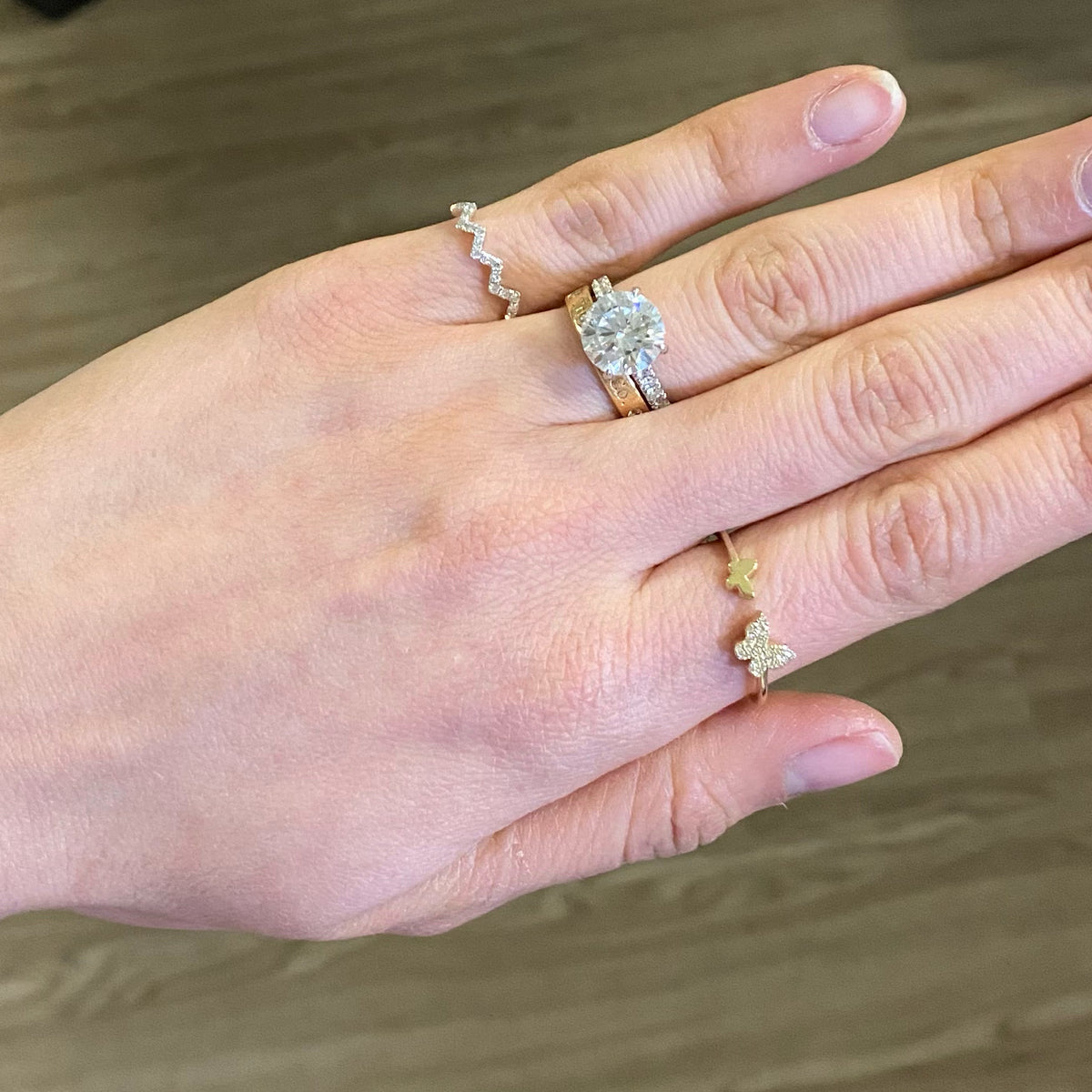 Female model wearing Diamond Zig-zag Pinky Ring- 14K white gold weighing 0.84 grams  - 17 round diamonds totaling 0.13 carats