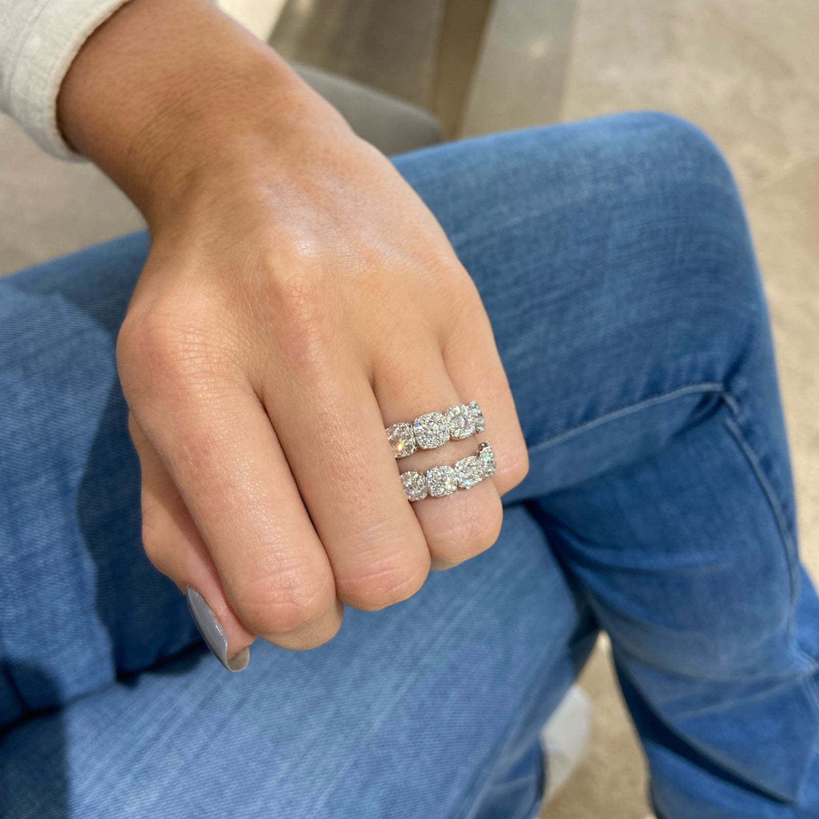 Halo Diamond Cushions Wedding Band - 18K gold weighing 3.09 grams  - 5 round diamonds weighing 0.31 carats  - 40 round diamonds weighing 0.48 carats