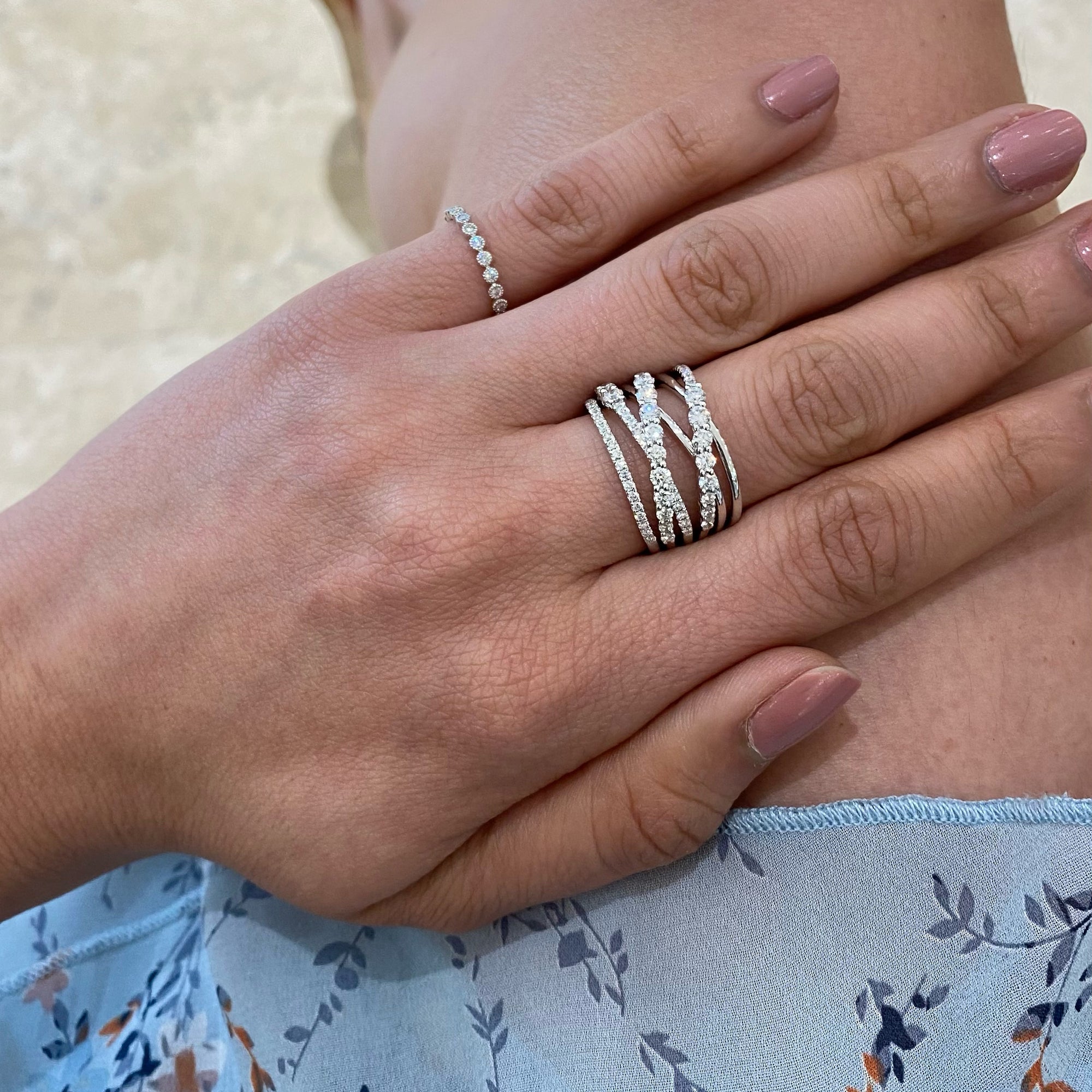 Prong-set Diamond & Gold Strand Fashion Ring  -18k gold weighing 8.58 grams  -13 round diamonds weighing .64 carats  -55 round diamonds weighing .51 carats