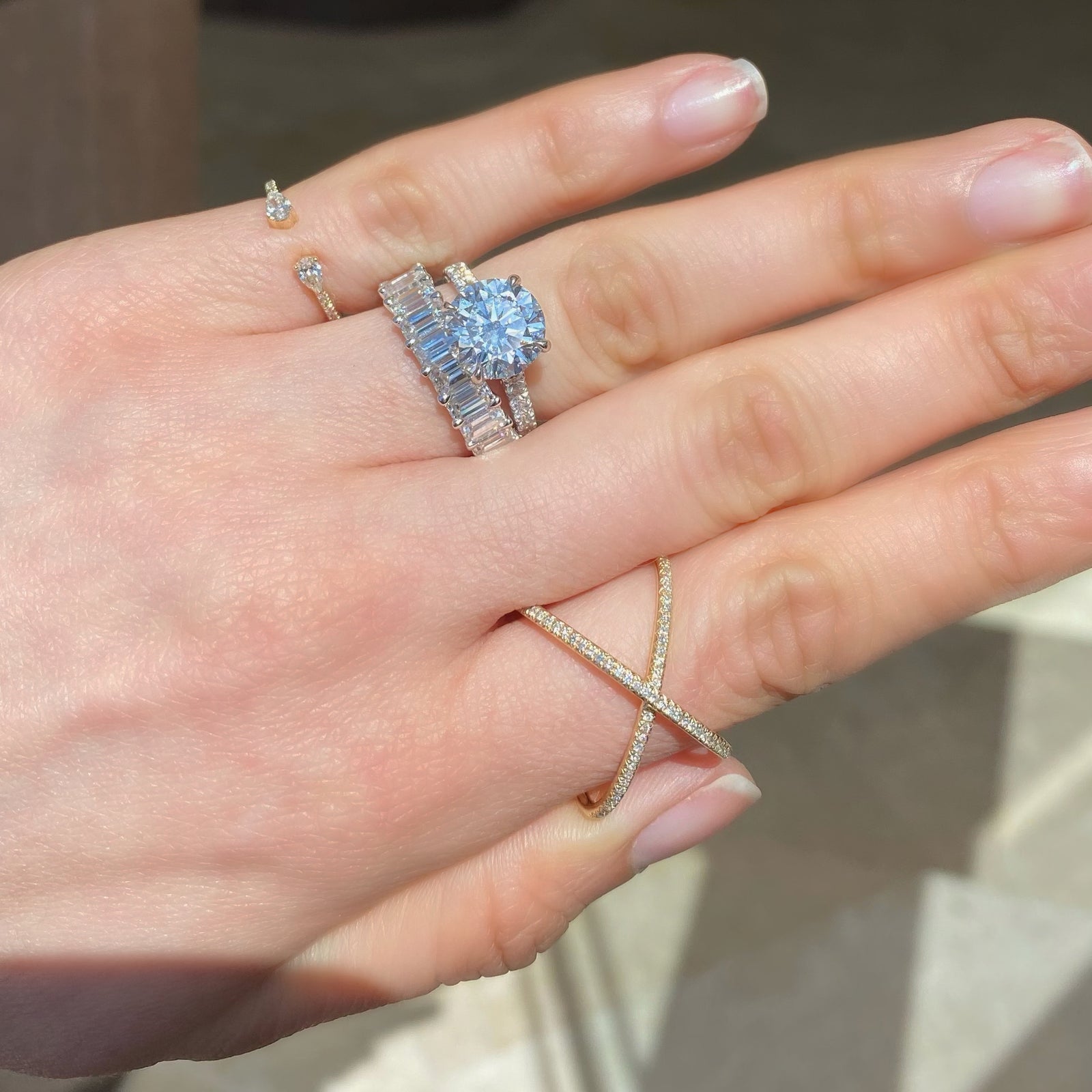 Emerald-Cut Diamond Wedding Band  - 18K gold weighing 4.09 grams  - 10 emerald-cut diamonds totaling 2.45 carats (GIA-graded F-G color, VS clarity)