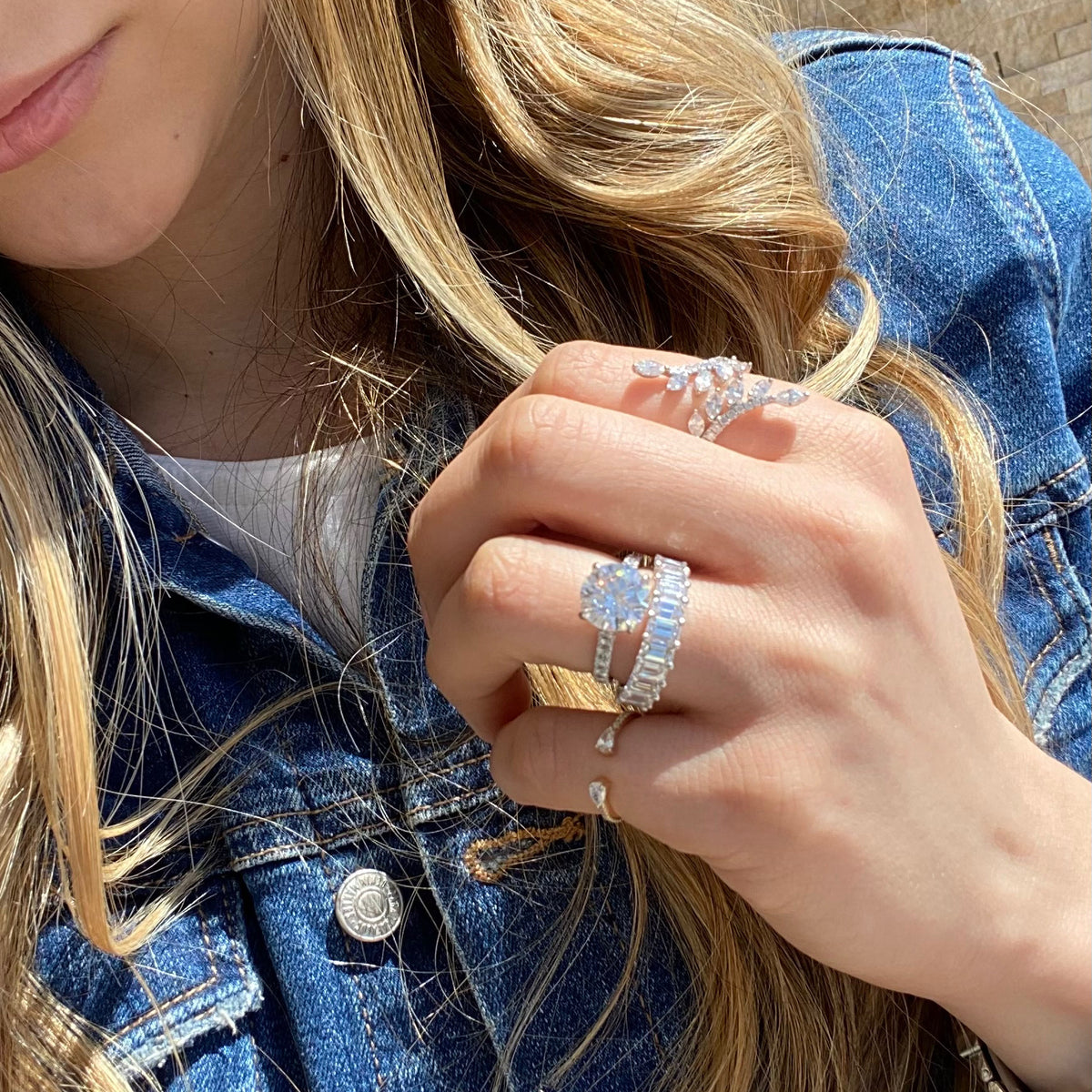 Female Model Wearing Emerald-Cut Diamond Wedding Band  - 18K gold weighing 4.09 grams  - 10 emerald-cut diamonds totaling 2.45 carats (GIA-graded F-G color, VS clarity)