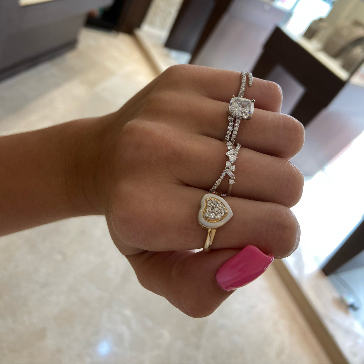 Female model wearing Bezel-set diamond curved wedding band - 18K gold weighing 2.09 grams  - 17 round diamonds totaling 0.25 carats