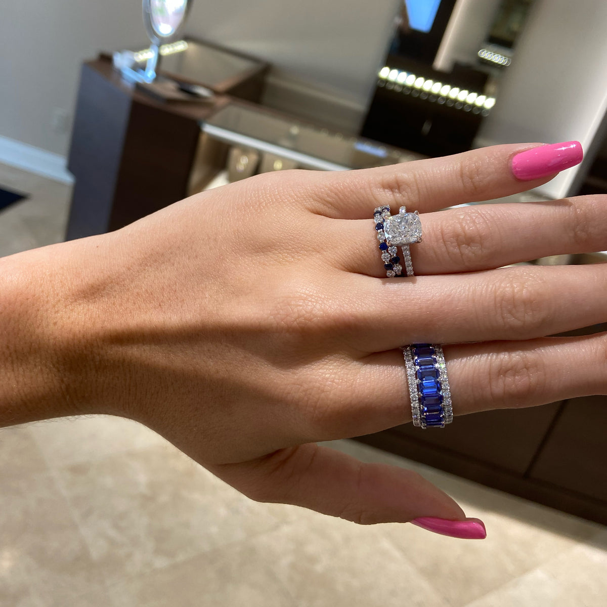 Female model wearing Tanzanite & diamond band - 18K gold weighing 6.06 grams  - 9 tanzanites totaling 2.55 carats  - 26 round diamonds totaling 0.52 carats