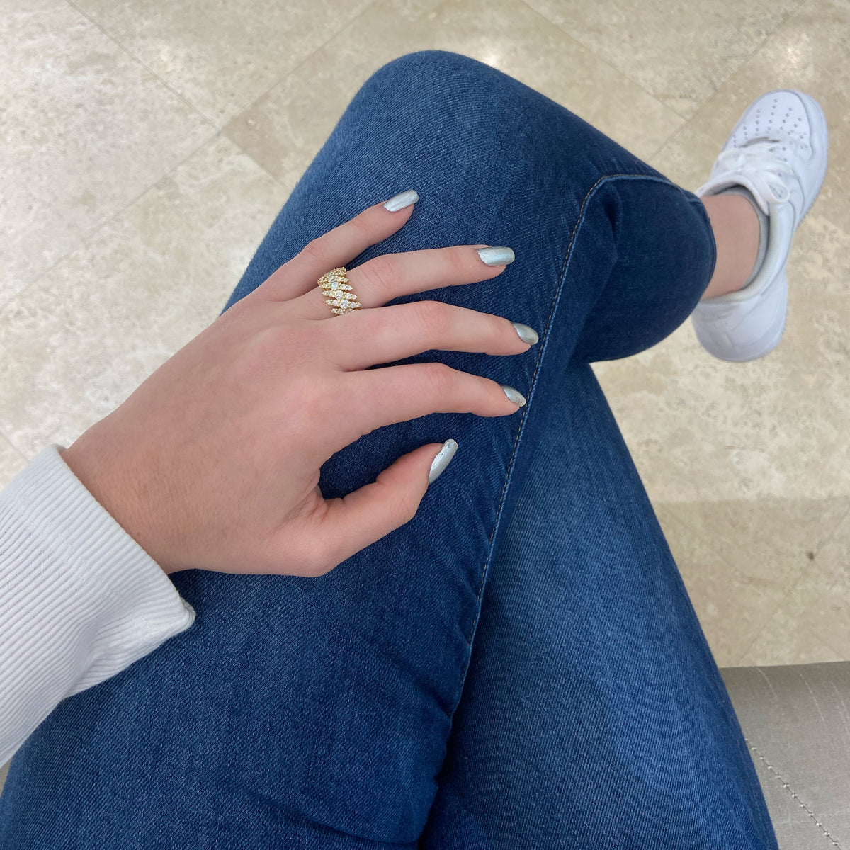 Female model wearing Diamond Thick Wave Band -18K gold weighing 7.66 grams -15 round diamonds totaling 2.05 carats -30 round diamonds totaling 0.60 carats -30 round diamonds totaling 1.35 carats