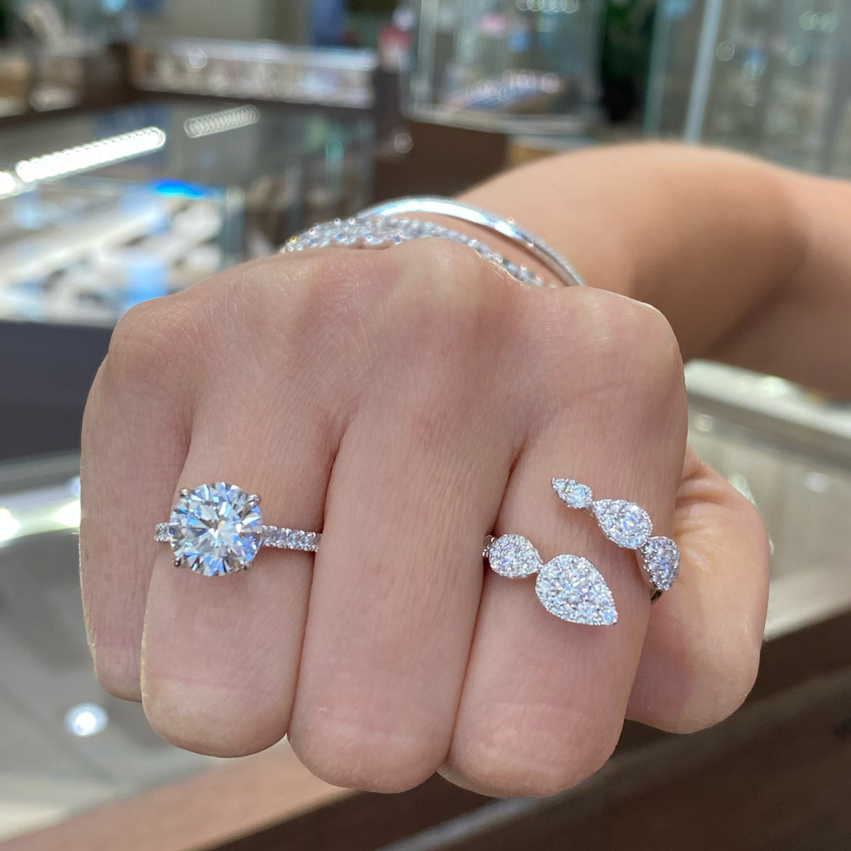 Female Model Wearing Diamond Teardrops Wrap Ring  - 18K gold weighing 3.68 grams  - 48 round diamonds totaling 1.15 carats