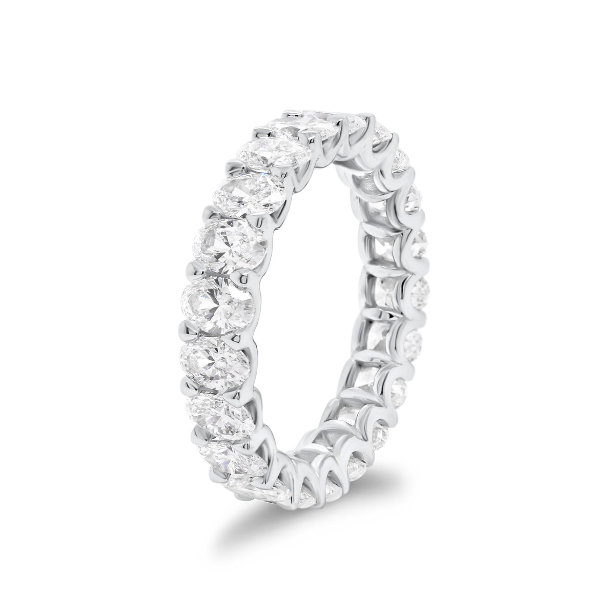 Oval Diamond Eternity Band  - 18K gold weighing 3.11 grams  - 21 oval brilliant-cut diamonds totaling 3.15 carats (GIA-graded G color, VS clarity)