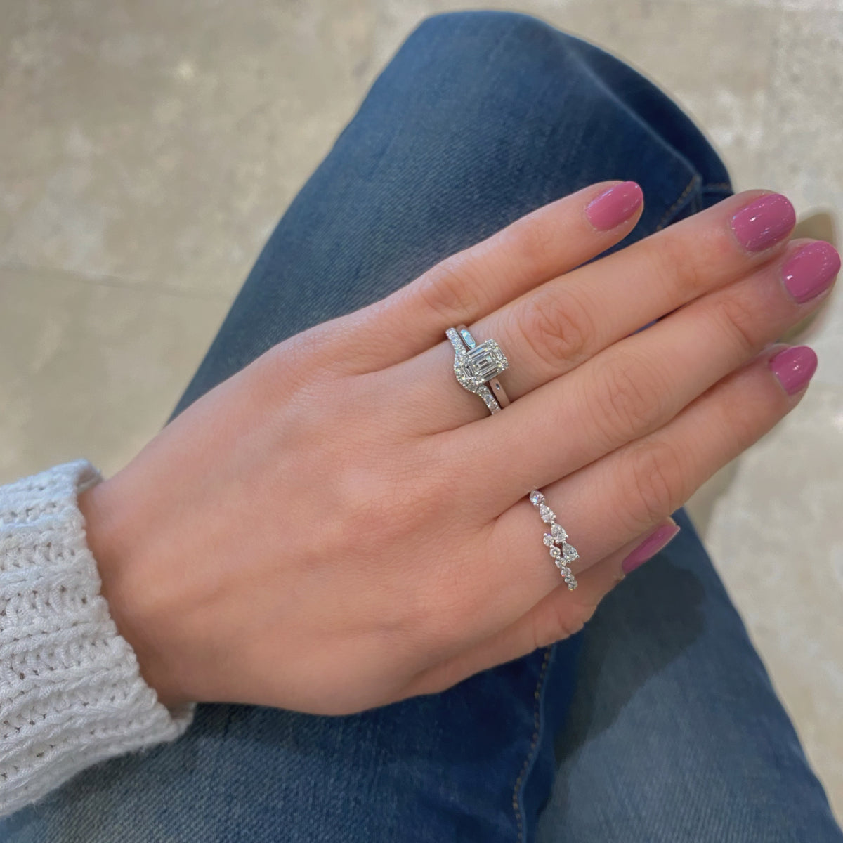 Female model wearing Pear-Shaped Diamond Open Wrap Ring - 18K gold weighing 1.75 grams  - 8 round diamonds weighing 0.20 carats  - 4 pear-shaped diamonds weighing 0.31 carats